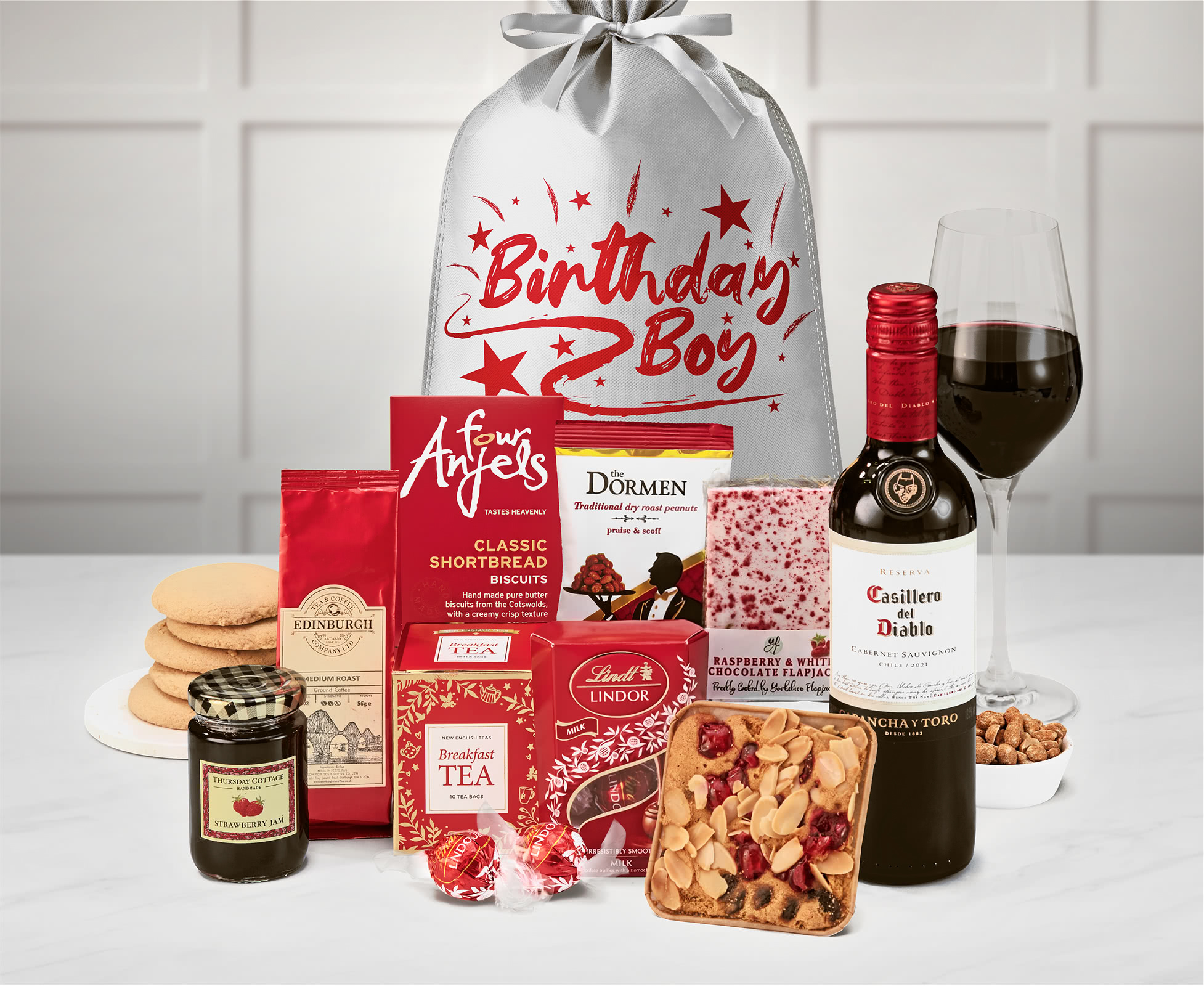 Birthday For Him Delicious Delights Gift With Casillero Del Diablo Cabernet Sauvignon in a Silver, "birthday Boy" Printed Sack