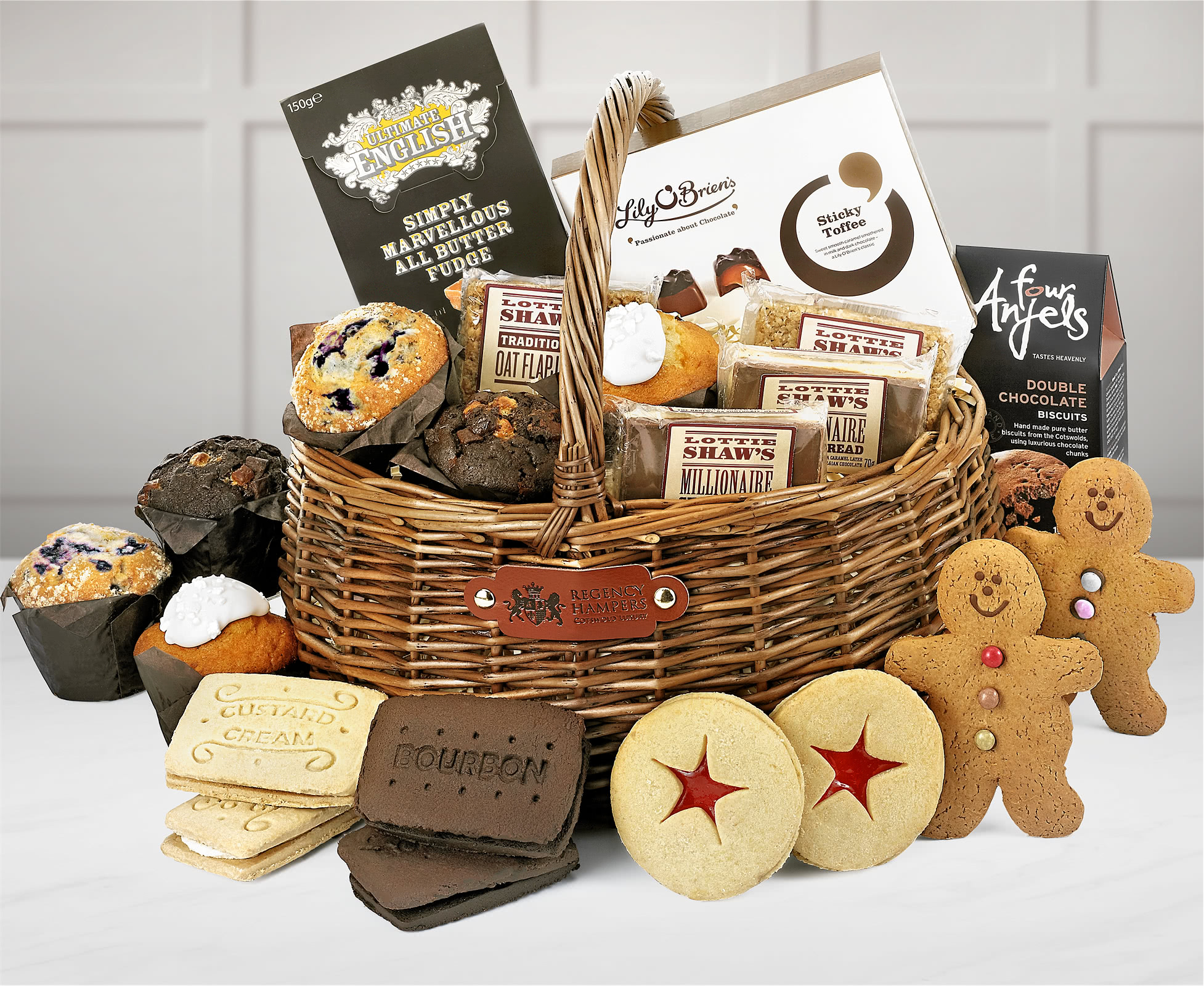 An Easter basket with muffins, flapjack, biscuits and chocolate treats.