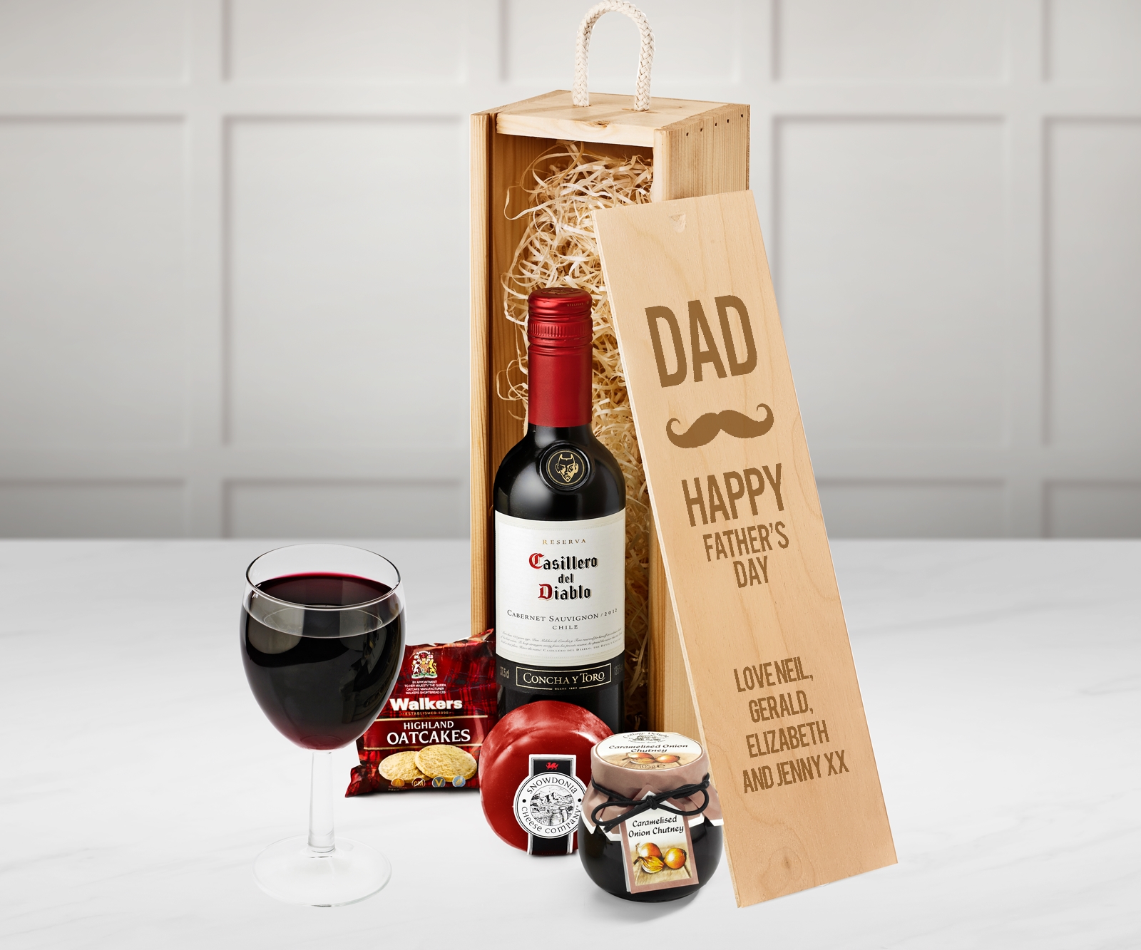 A gift box with red wine and cheese.